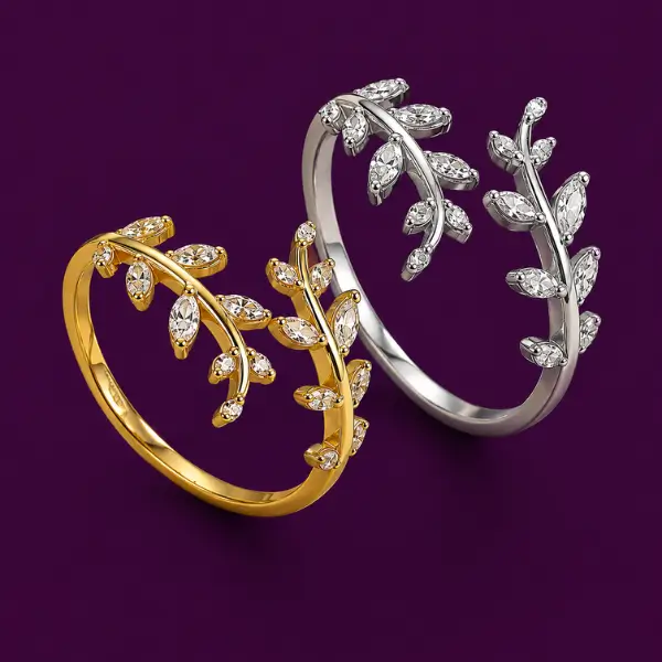Gold and silver open leaf ring designs with delicate branch detailing