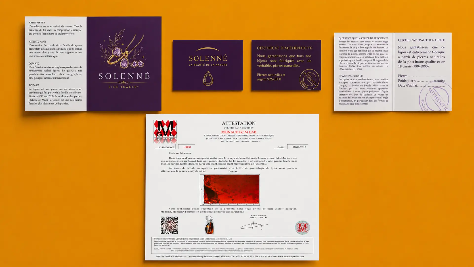 Solenné certificates of authenticity for gemstones and precious metals laid out on an orange background