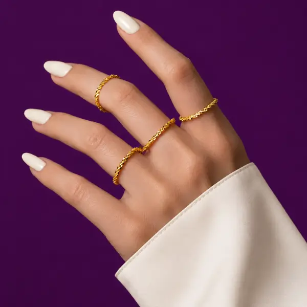 Gold Vermeil stackable rings worn together on the hand showing layered stack.